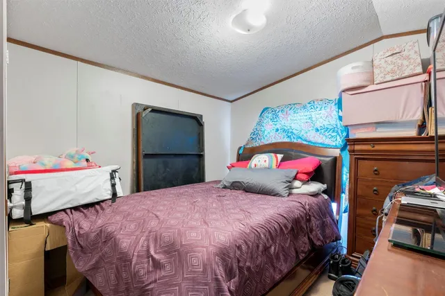 a view of a room with gym equipment and a table