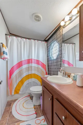 a bedroom with a bed and dresser