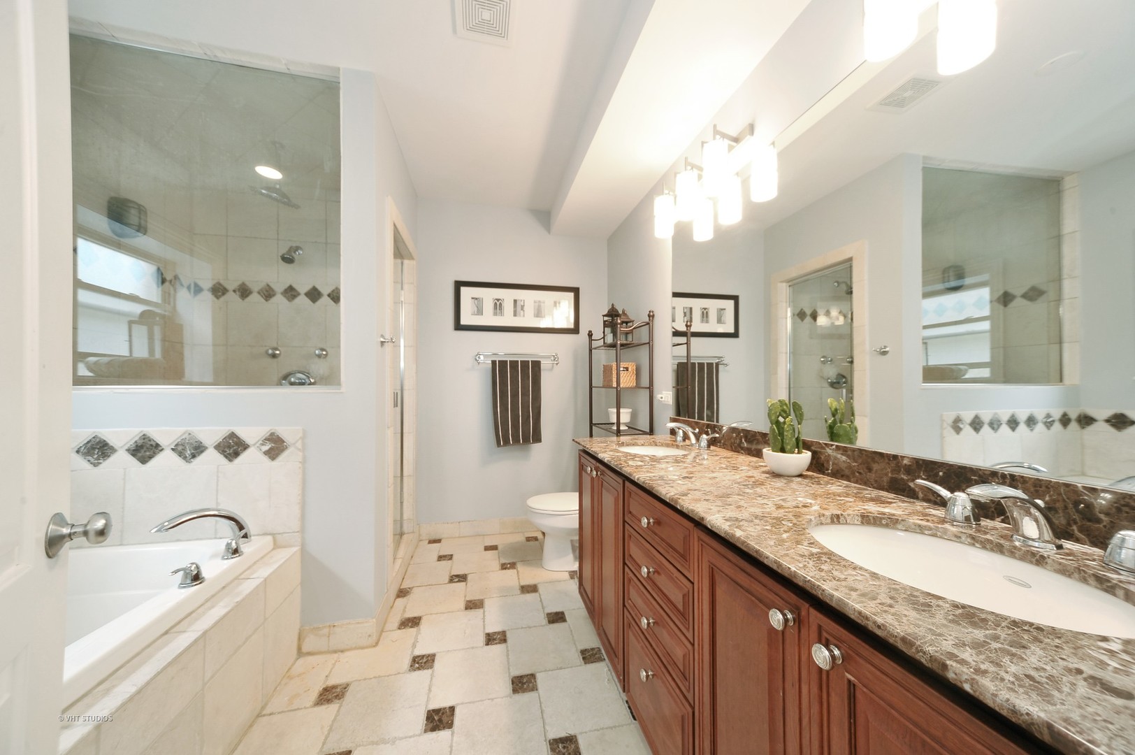 3933 North Marshfield Avenue, Unit 2S Chicago, IL 60613 - Photo 11 of 17 a bathroom with a granite countertop sink mirror and a bathtub