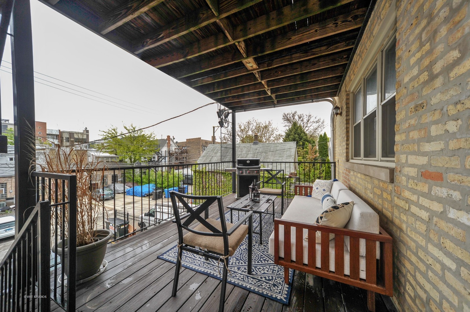 3933 North Marshfield Avenue, Unit 2S Chicago, IL 60613 - Photo 16 of 17 a view of a balcony with furniture