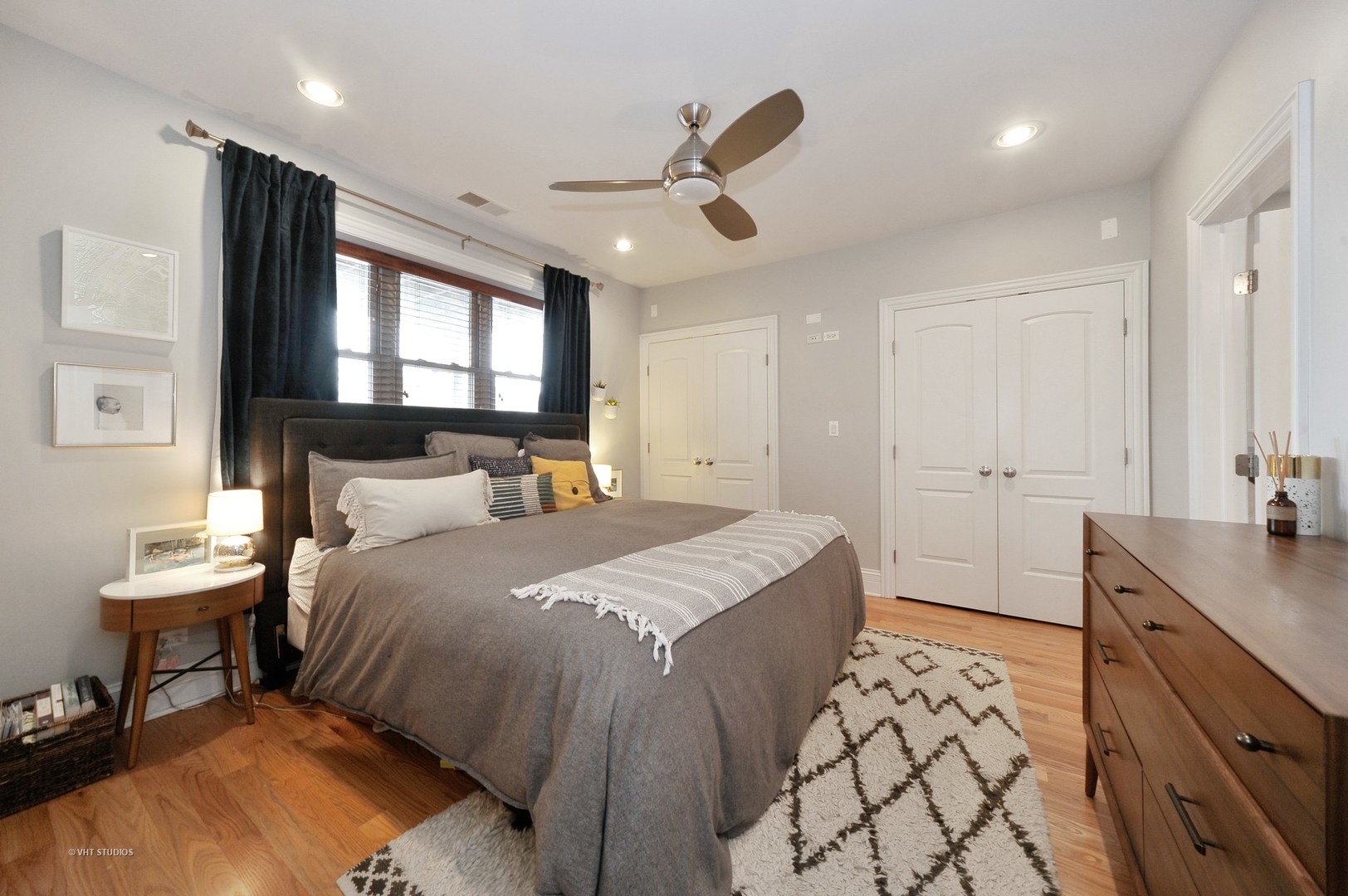 3933 North Marshfield Avenue, Unit 2S Chicago, IL 60613 - Photo 10 of 17 a bedroom with a bed and a dresser