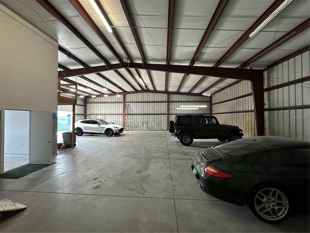 4459 Holden Road Lakeland, FL 33811 - Photo 12 of 27 a view of parking garage with cars