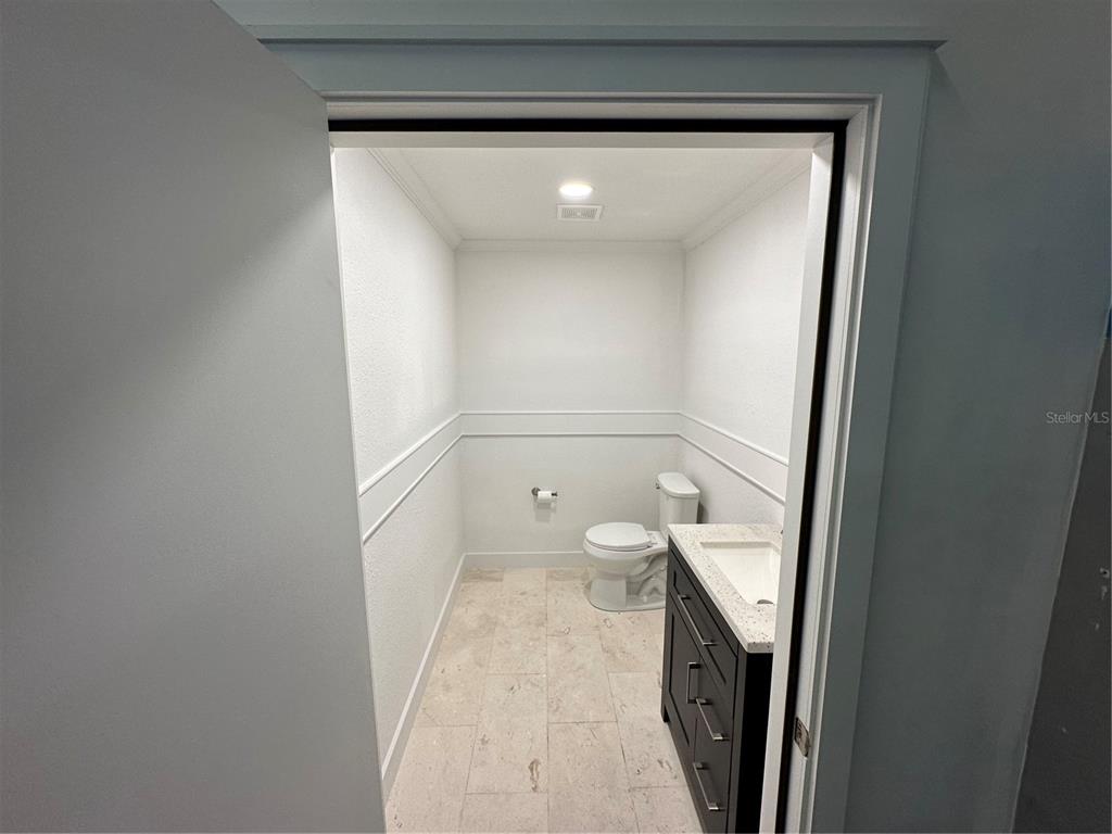 4459 Holden Road Lakeland, FL 33811 - Photo 13 of 27 a bathroom with a sink and toilet