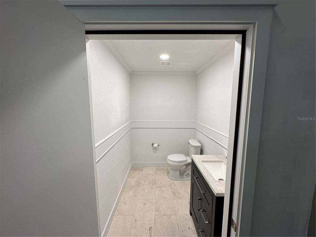 4459 Holden Road Lakeland, FL 33811 - Photo 18 of 27 a bathroom with a toilet and a sink