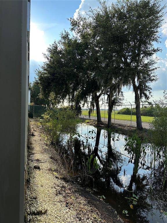 4459 Holden Road Lakeland, FL 33811 - Photo 26 of 27 a view of a lake with a tree