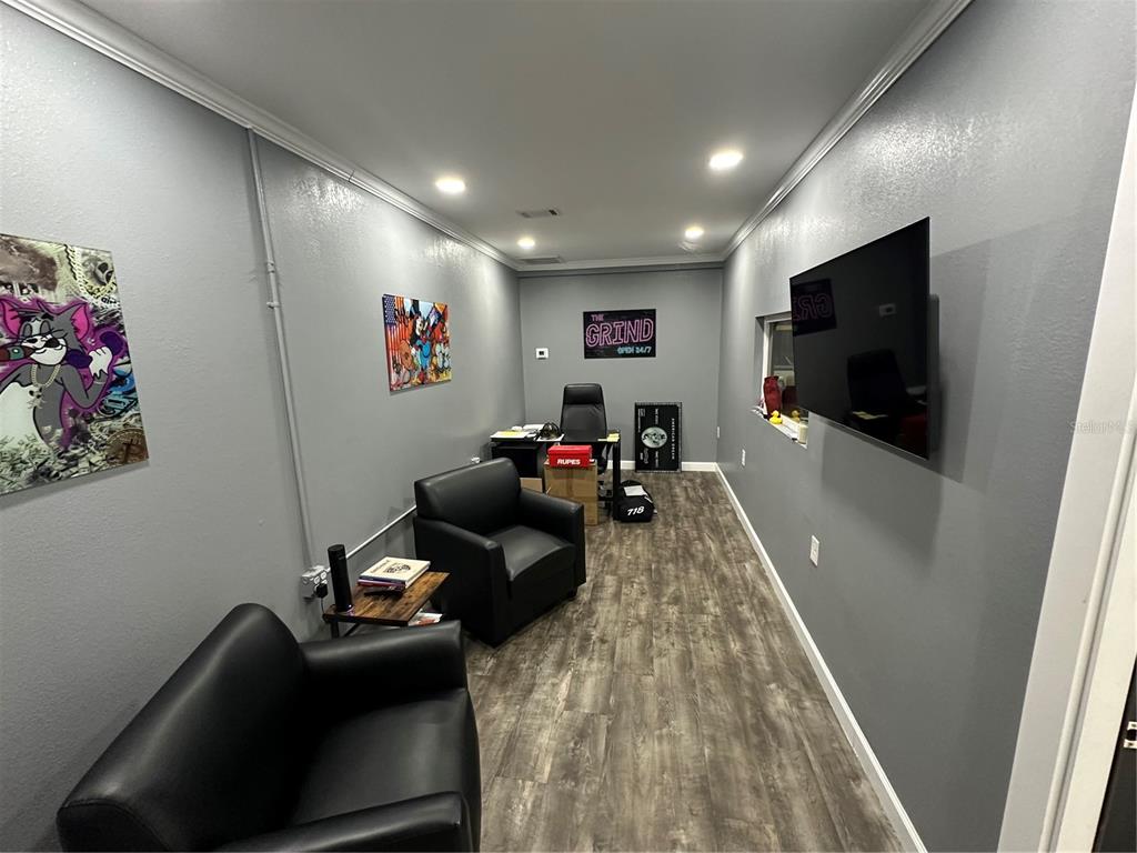 4459 Holden Road Lakeland, FL 33811 - Photo 3 of 27 a living room with furniture and a flat screen tv