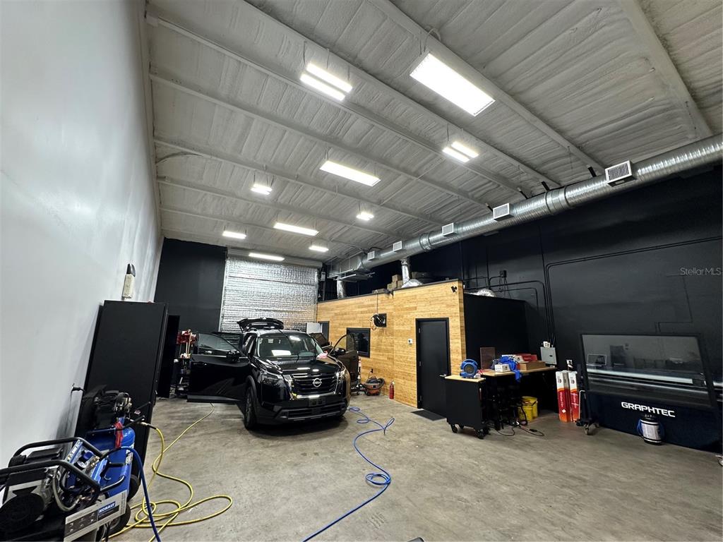 4459 Holden Road Lakeland, FL 33811 - Photo 5 of 27 a room with furniture and a flat screen tv