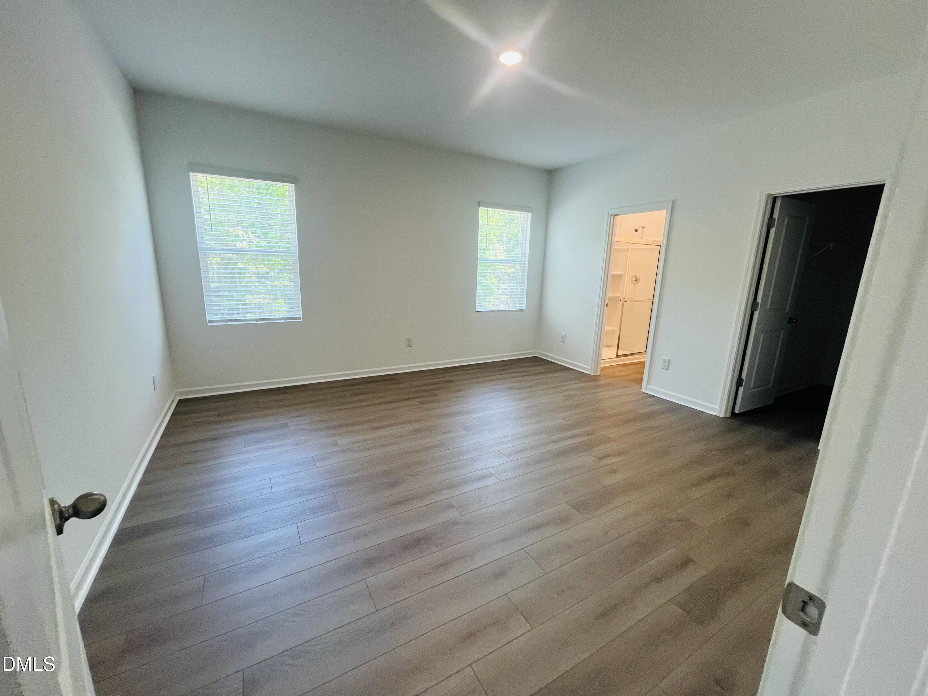 11487 Salers Loop Middlesex, NC 27557 - Photo 18 of 31 a view of an empty room with wooden floor and a window