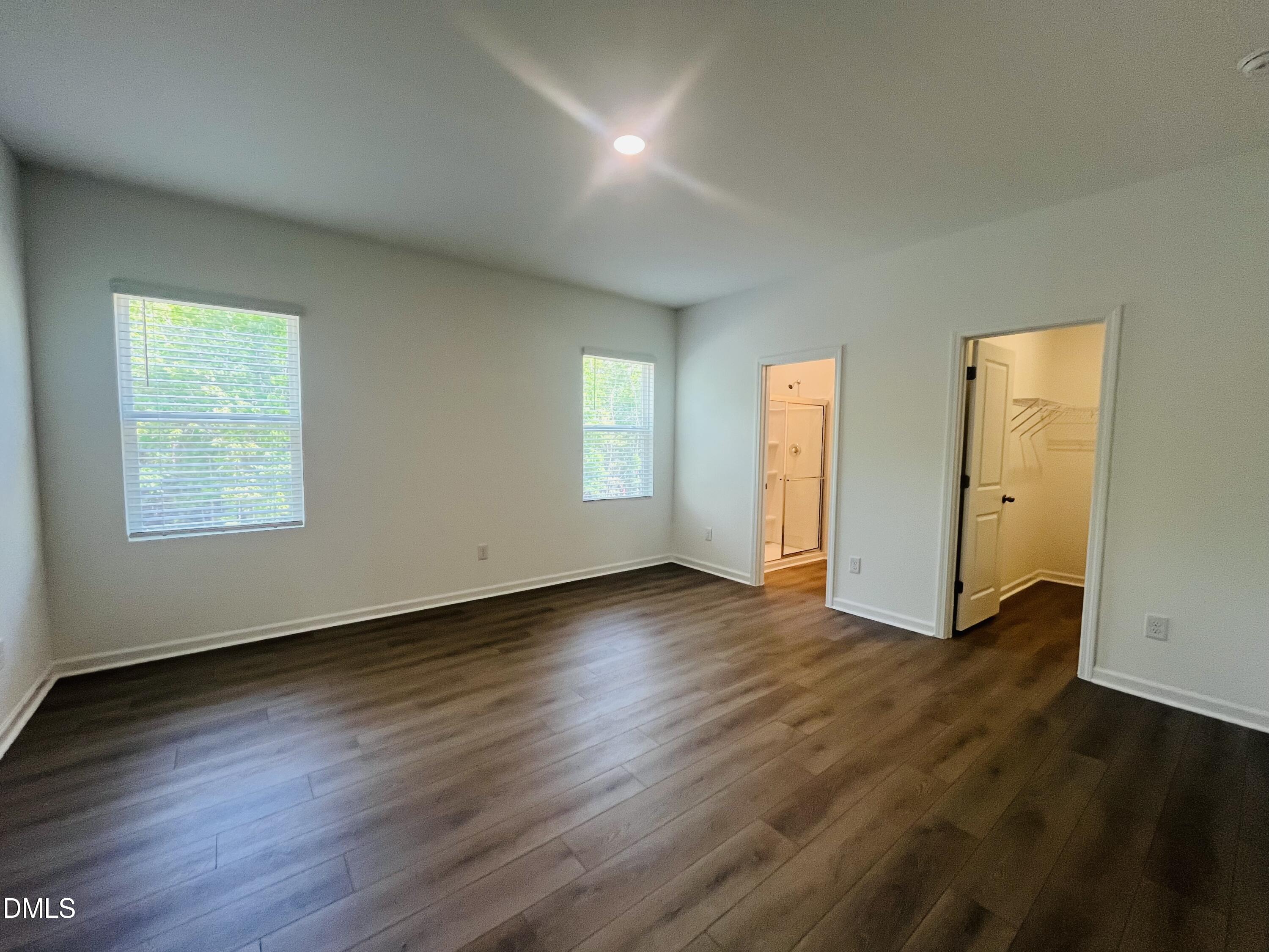 11487 Salers Loop Middlesex, NC 27557 - Photo 19 of 31 an empty room with wooden floor and windows