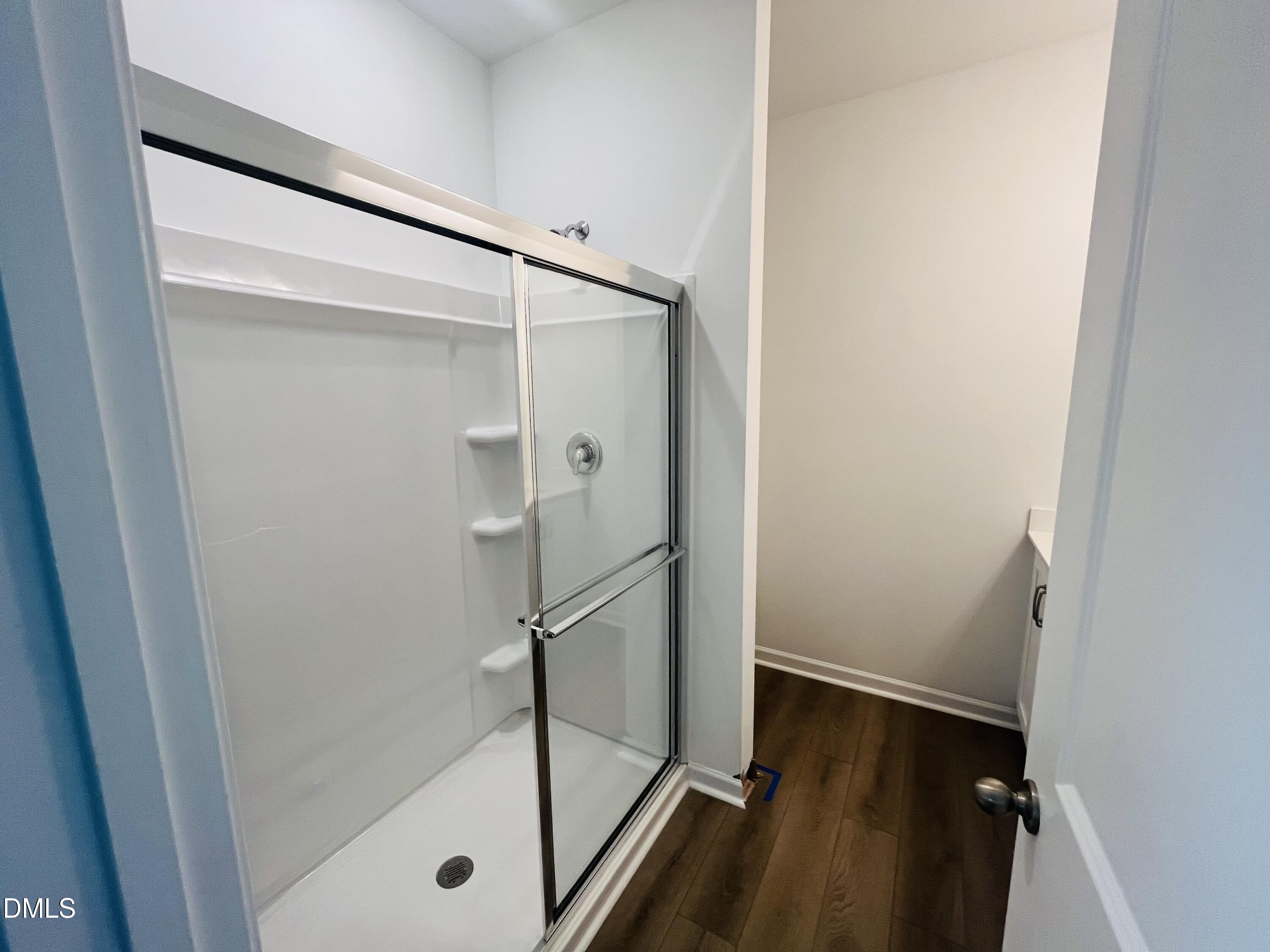 11487 Salers Loop Middlesex, NC 27557 - Photo 21 of 31 a bathroom with a glass shower door