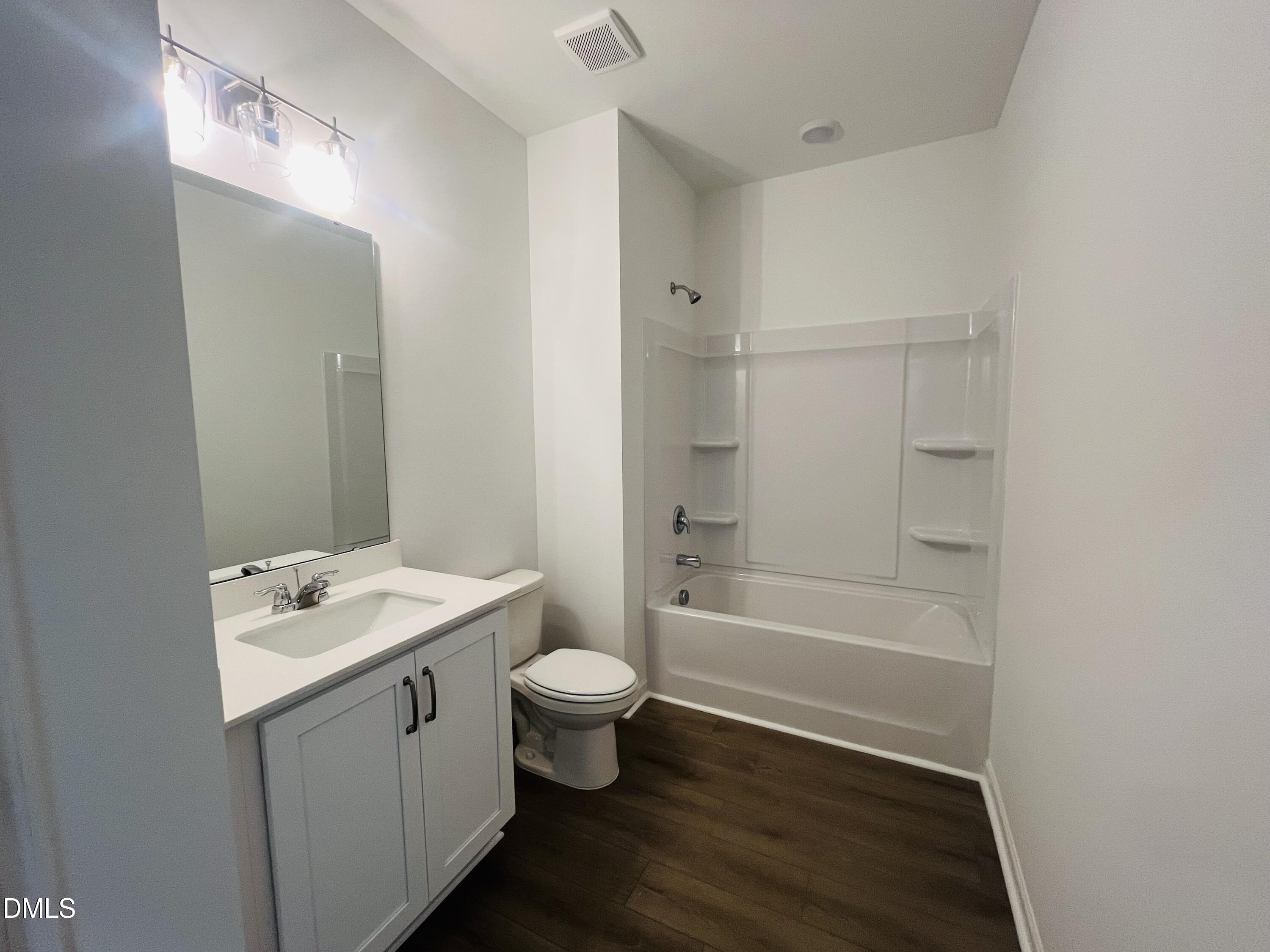 11487 Salers Loop Middlesex, NC 27557 - Photo 24 of 31 a bathroom with a sink a toilet and shower