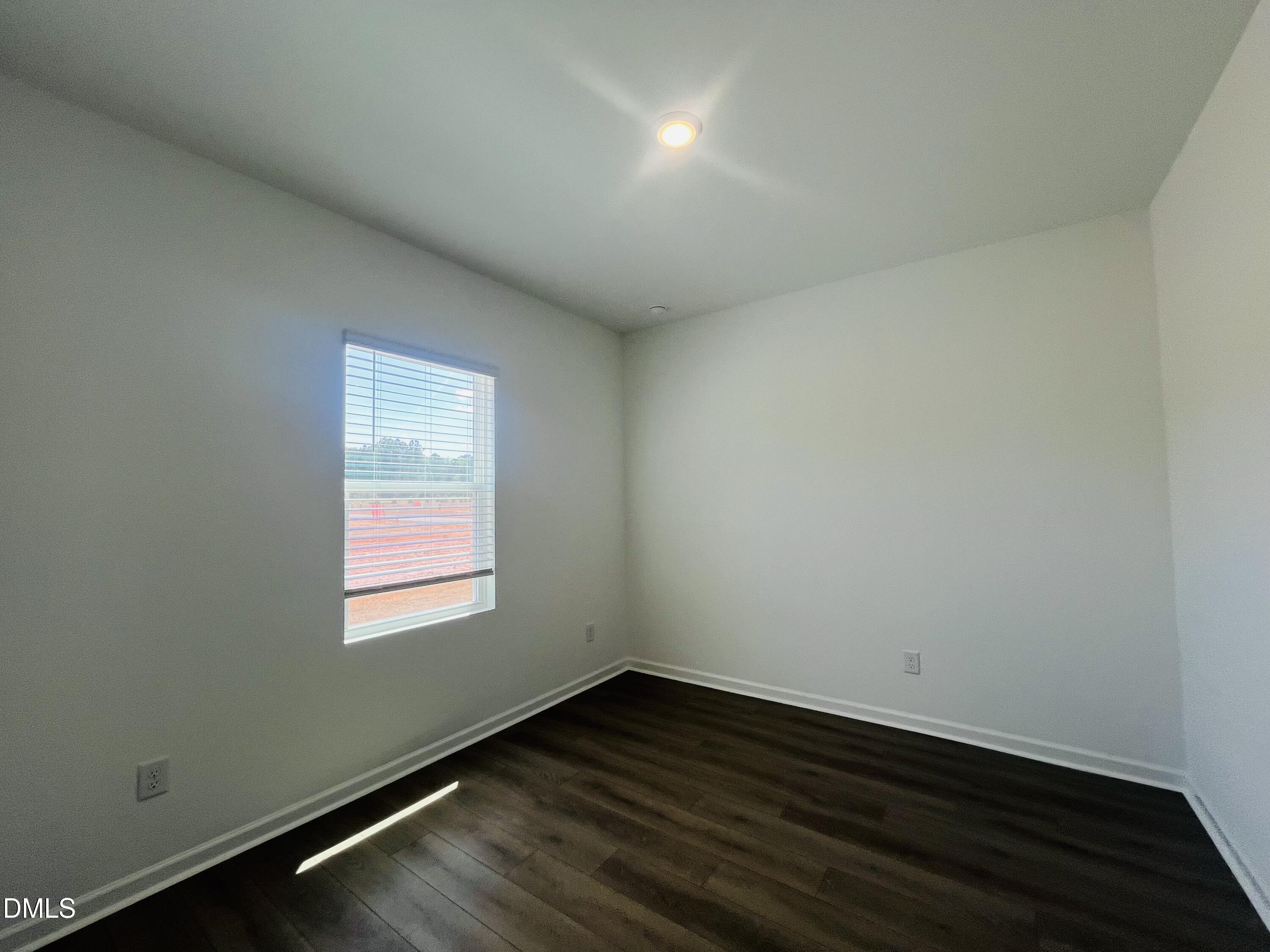 11487 Salers Loop Middlesex, NC 27557 - Photo 26 of 31 an empty room with wooden floor and windows