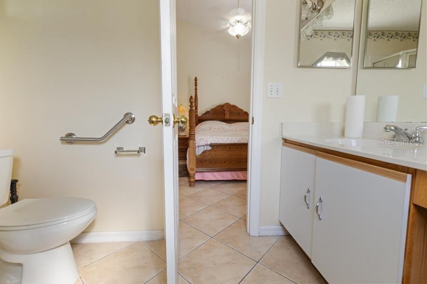 11251 Pickford Street Spring Hill, FL 34609 - Photo 12 of 29 a bathroom with a sink and a toilet