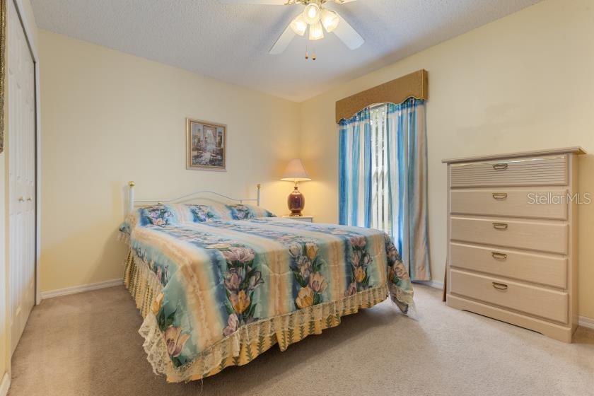 11251 Pickford Street Spring Hill, FL 34609 - Photo 13 of 29 a bedroom with a bed and a window