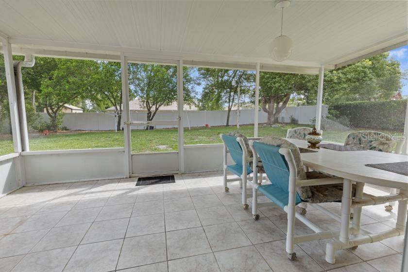 11251 Pickford Street Spring Hill, FL 34609 - Photo 18 of 29 a dining room with furniture and large windows