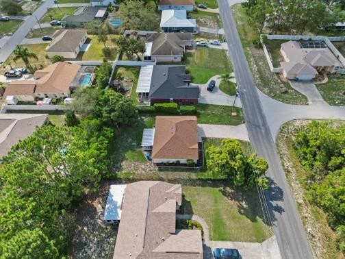 11251 Pickford Street Spring Hill, FL 34609 - Photo 23 of 29 an aerial view of multiple houses with yard