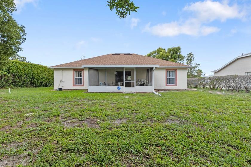 11251 Pickford Street Spring Hill, FL 34609 - Photo 26 of 29 a front view of a house with a yard