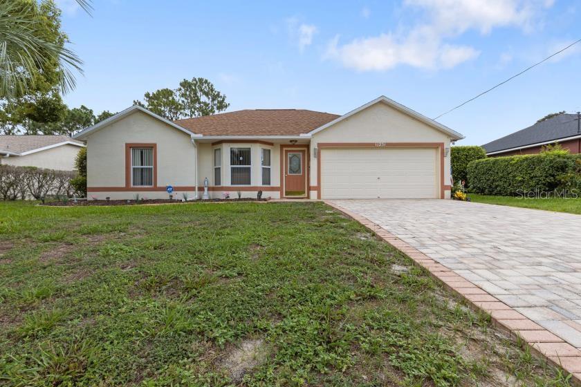 11251 Pickford Street Spring Hill, FL 34609 - Photo 28 of 29 a view of a house with a yard