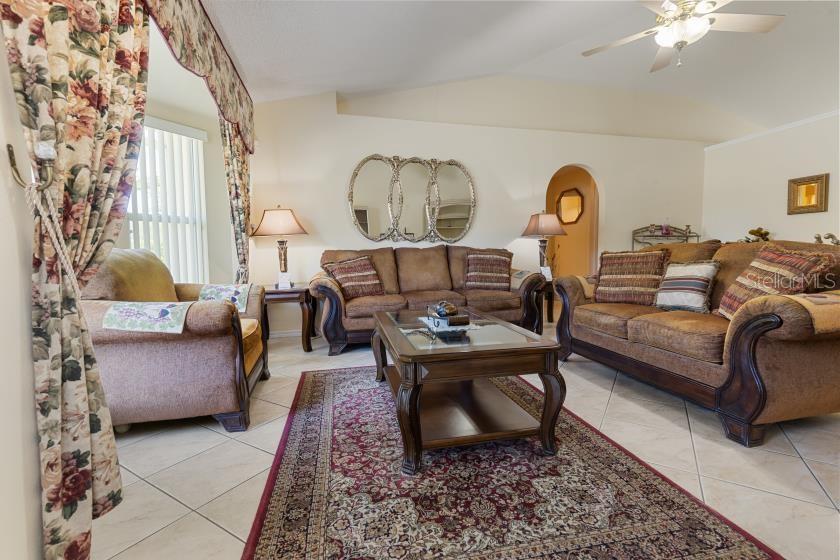 11251 Pickford Street Spring Hill, FL 34609 - Photo 3 of 29 a living room with furniture a rug and a window