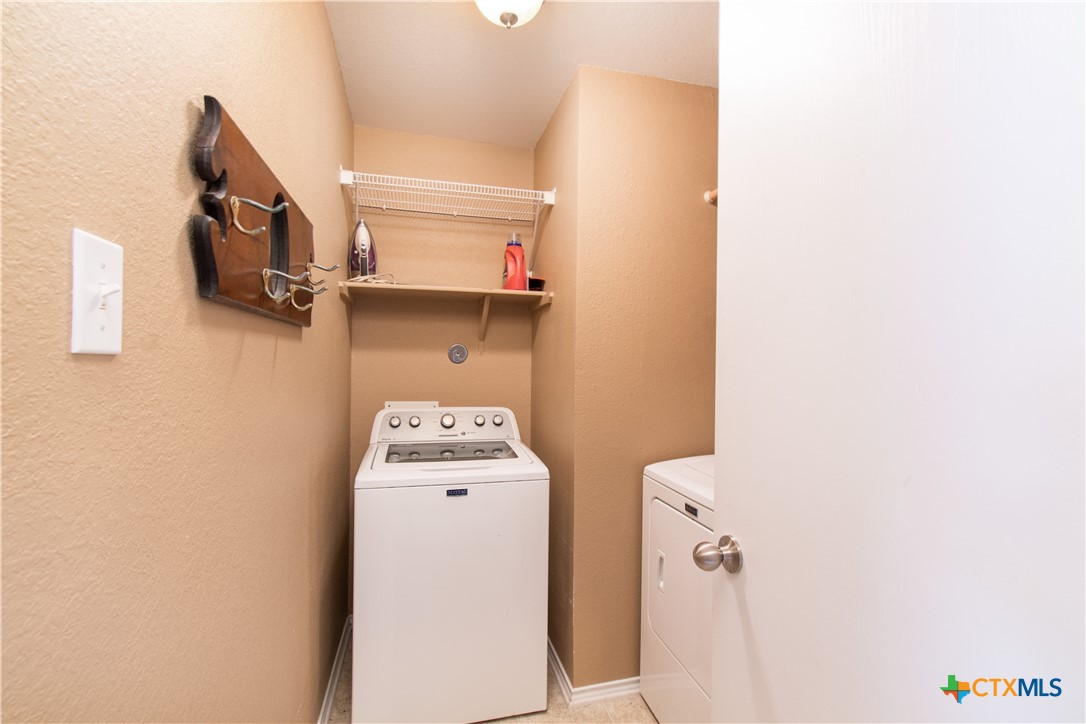 7916 Honeysuckle Temple, TX 76502 - Photo 11 of 20 a utility room with dryer and washer