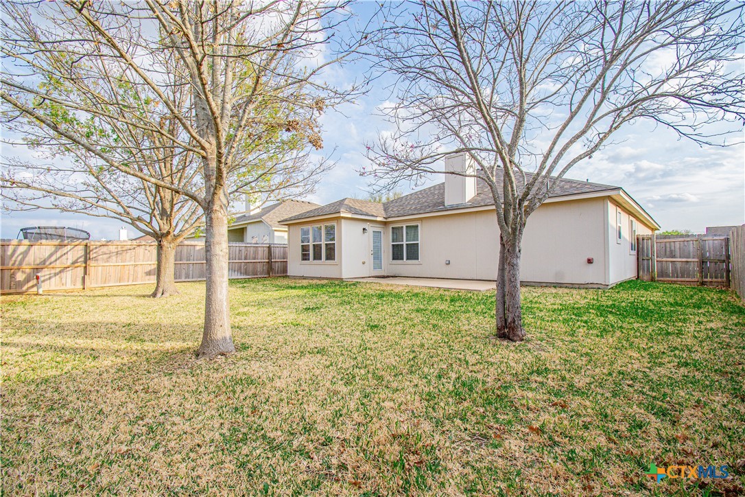 7916 Honeysuckle Temple, TX 76502 - Photo 2 of 20 a house with a big yard and large trees