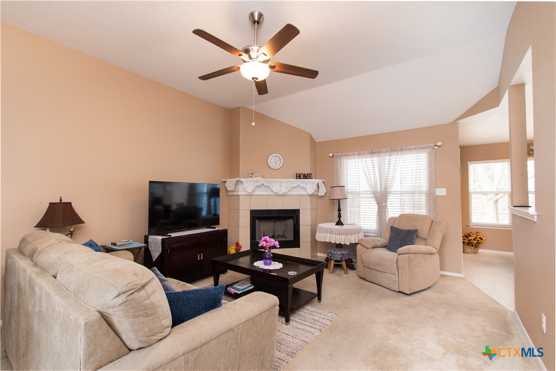 7916 Honeysuckle Temple, TX 76502 - Photo 4 of 20 a living room with furniture a fireplace and a large window