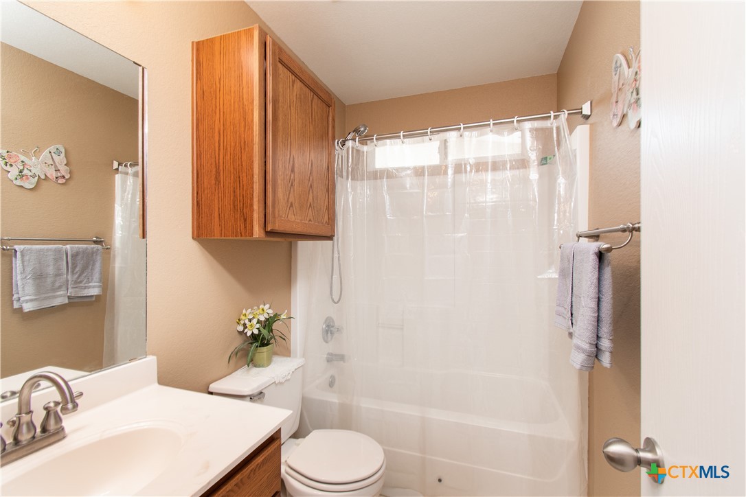 7916 Honeysuckle Temple, TX 76502 - Photo 9 of 20 a bathroom with a sink toilet and shower