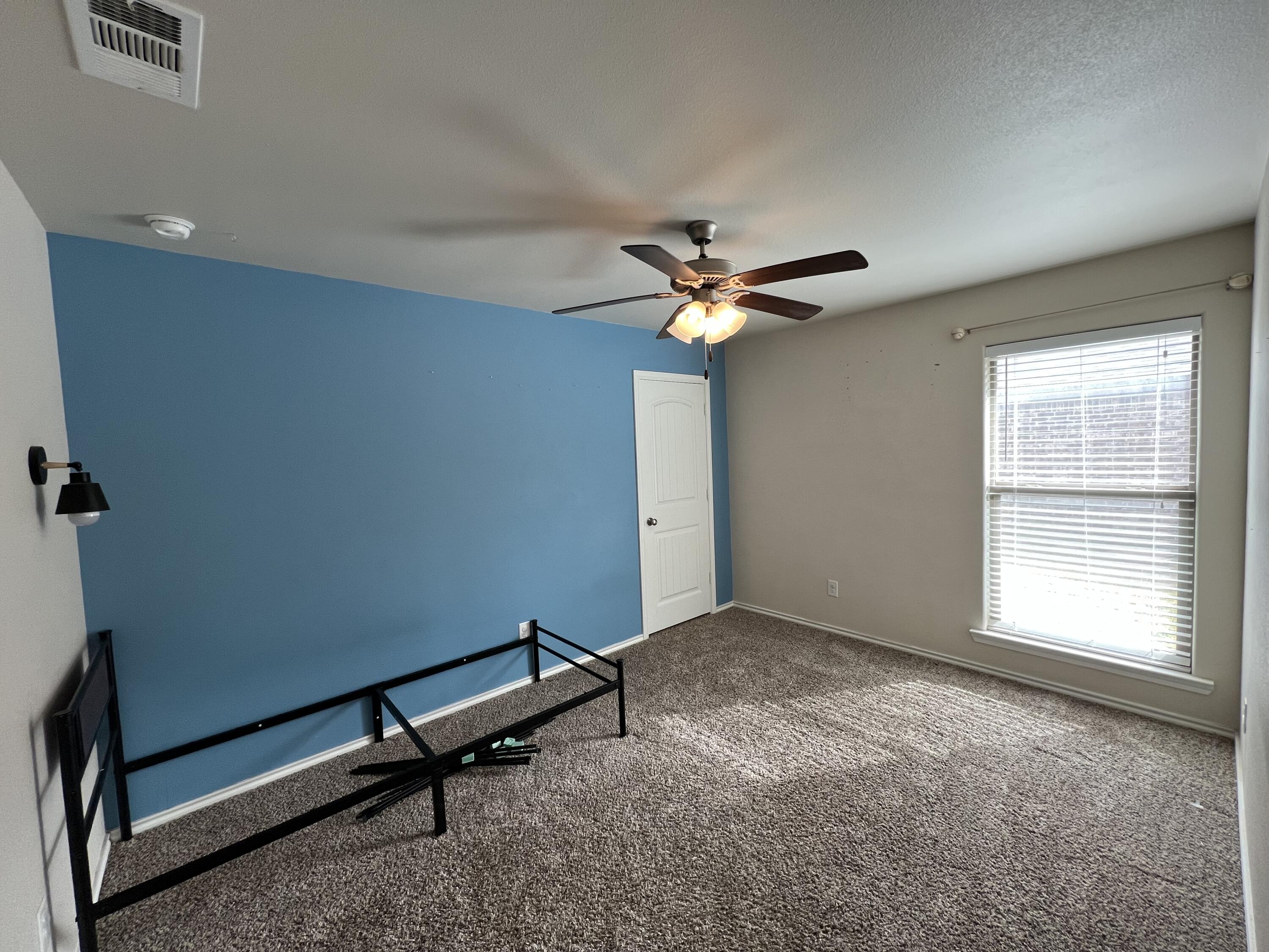 7349 100th Street Lubbock, TX 79424 - Photo 15 of 28 a view of an empty room with a window