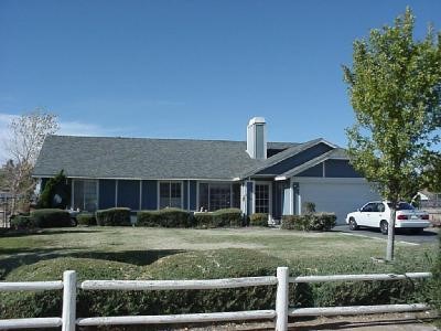 11940 Mohawk Road Apple Valley, CA 92308 - Photo 1 of 1 a front view of a house with a yard