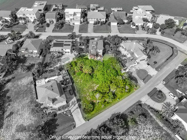 a aerial view of a house with a lake view