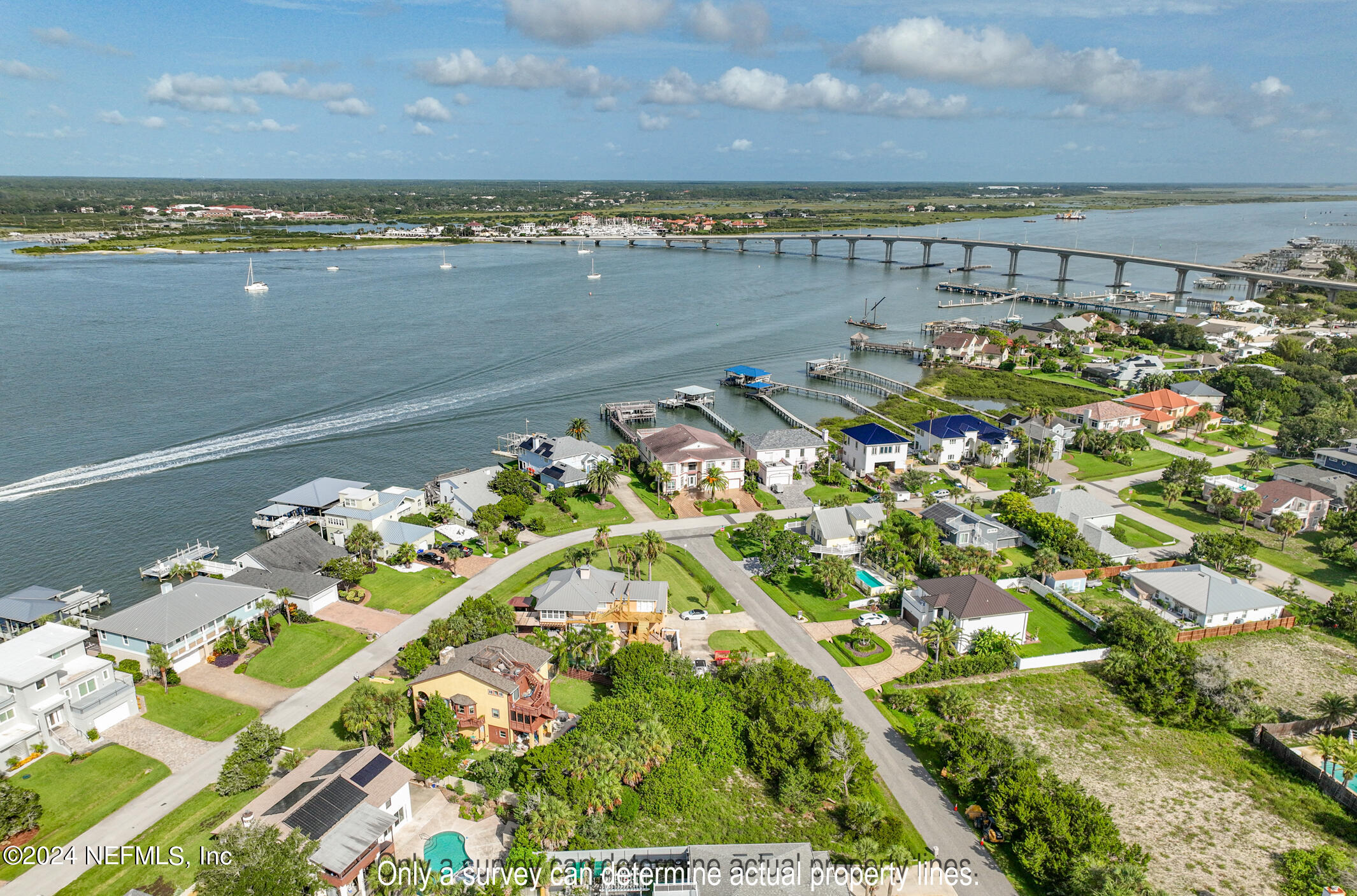 203 Sea Turtle Way St. Augustine, FL 32084 - Photo 26 of 28 a view of a lake with a building in the background
