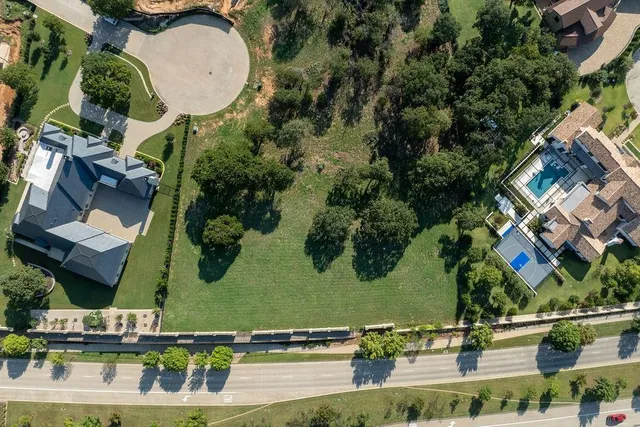 an aerial view of a house with a swimming pool