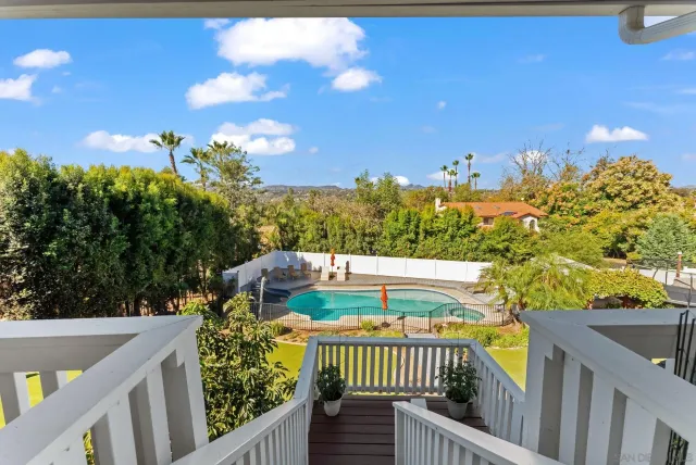 a bedroom with bed and a chandelier