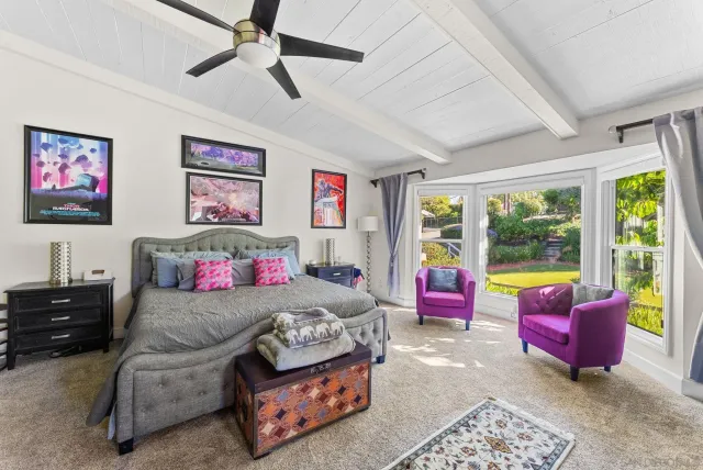 a bedroom with furniture and a bed