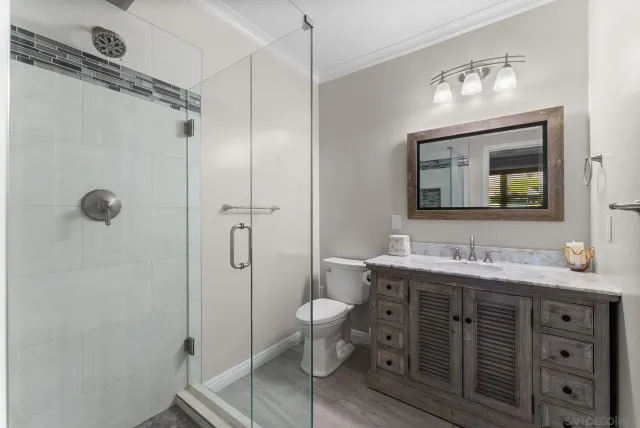 a view of a fence in the backyard