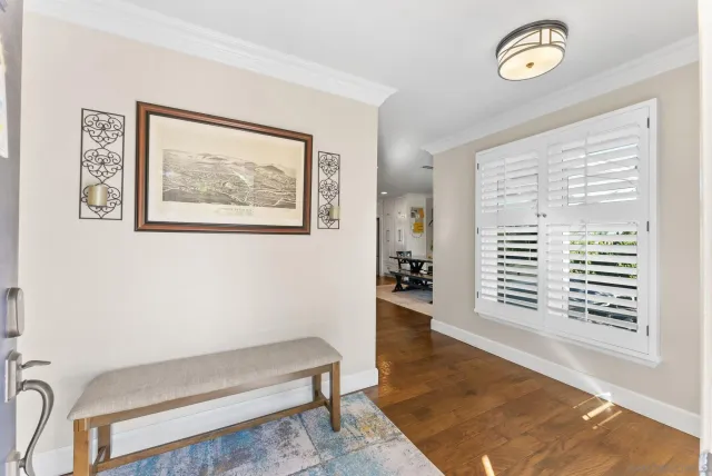 a kitchen with granite countertop stainless steel appliances and white cabinets