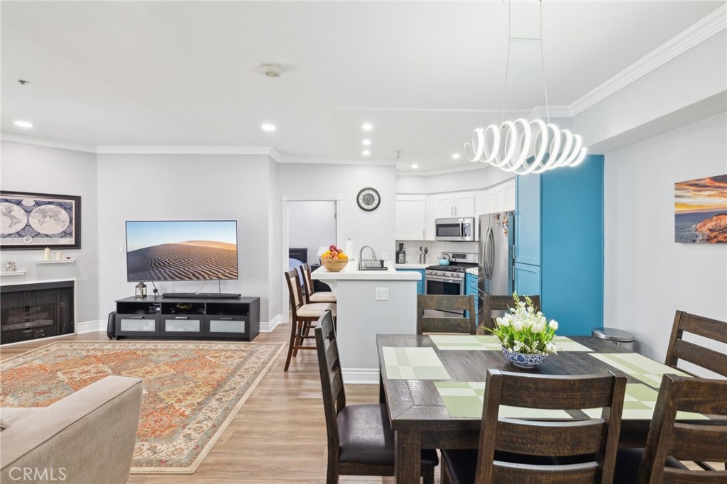 14914 Hamlin Street, Unit 104 Van Nuys, CA 91411 - Photo 1 of 10 a view of a dining room with furniture