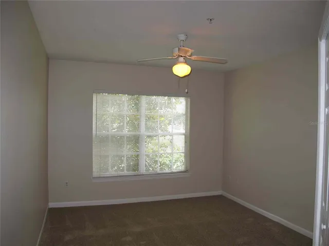 an empty room with window and window