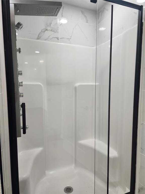 1133 Highway 2861 Comanche, TX 76442 - Photo 14 of 15 a bathroom with a glass shower door