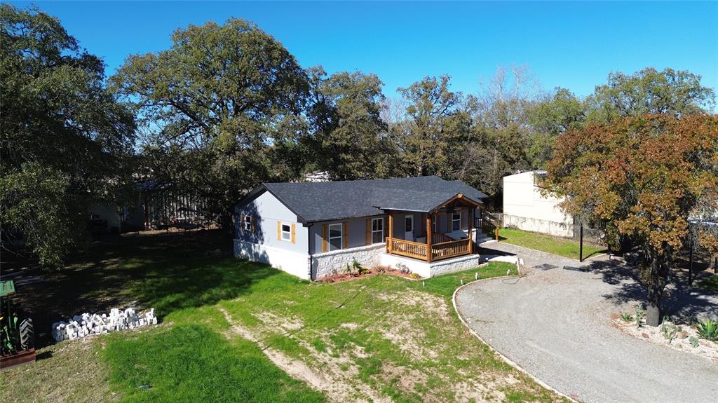 1133 Highway 2861 Comanche, TX 76442 - Photo 2 of 15 an aerial view of a house with garden