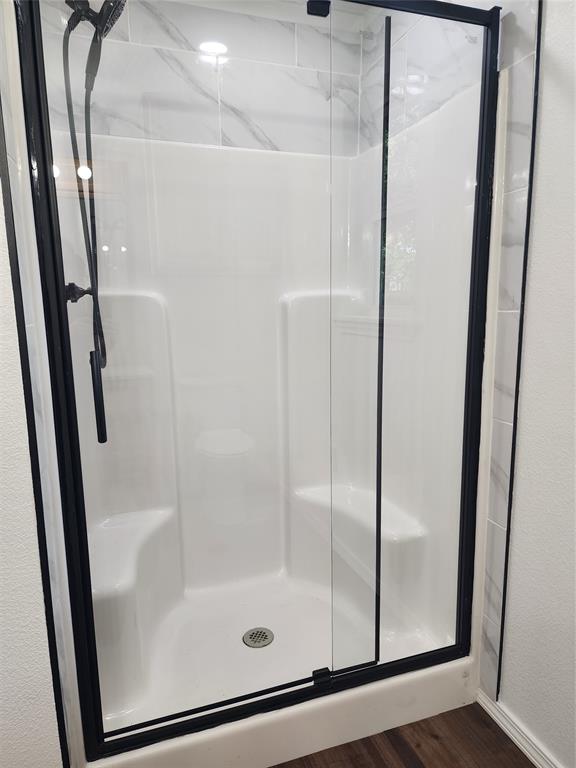 1133 Highway 2861 Comanche, TX 76442 - Photo 9 of 15 a bathroom with a glass door shower