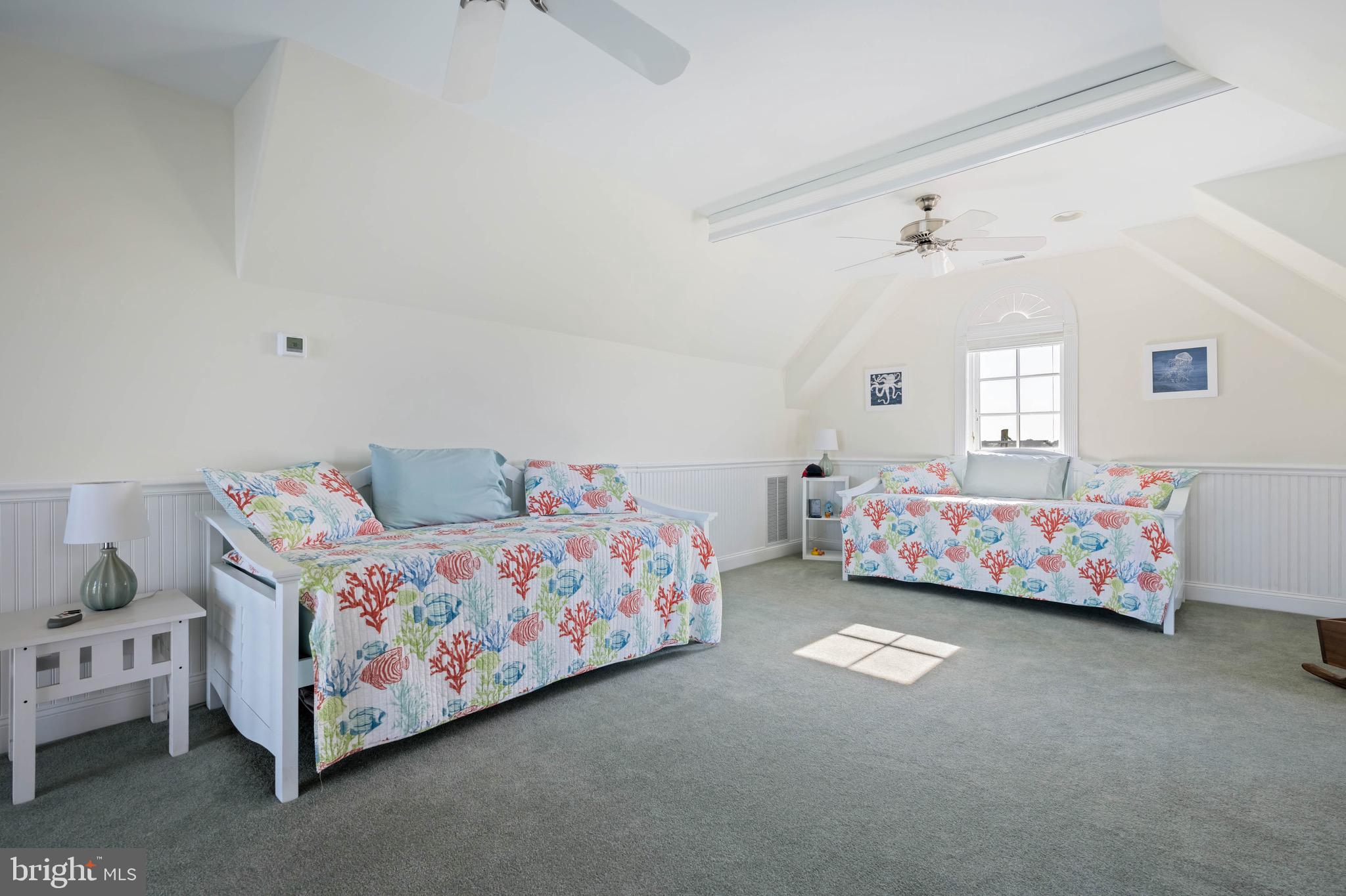 12959 Harbor Road Ocean City, MD 21842 - Photo 38 of 85 a bedroom with bed and a chandelier