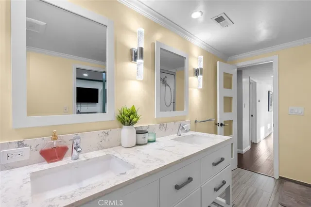 a bed room with a bed mirror and a window