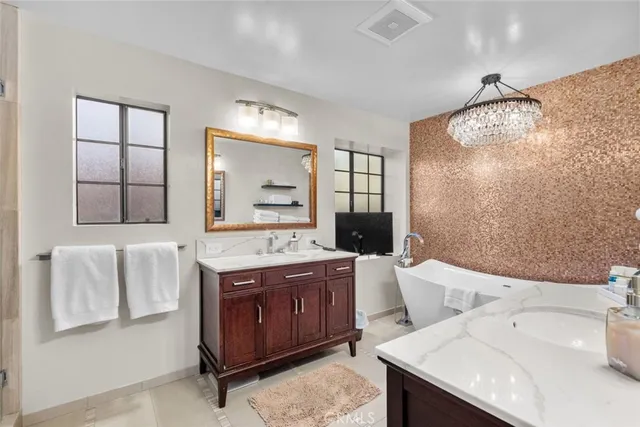 a view of a chairs and table in the balcony