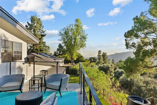 an outdoor space with furniture and outdoor view