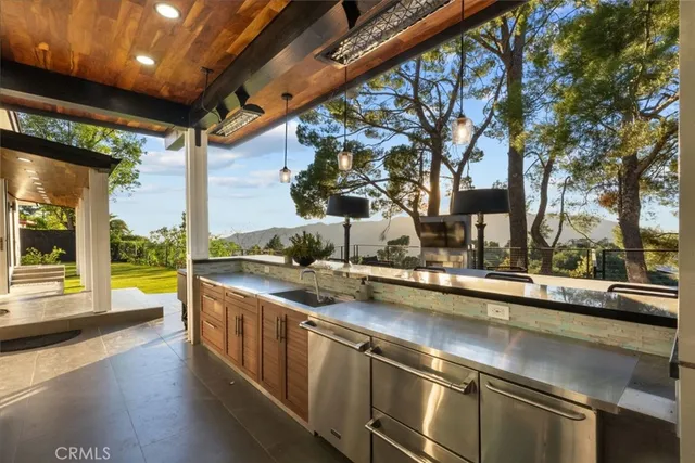 a view of a terrace with furniture and garden