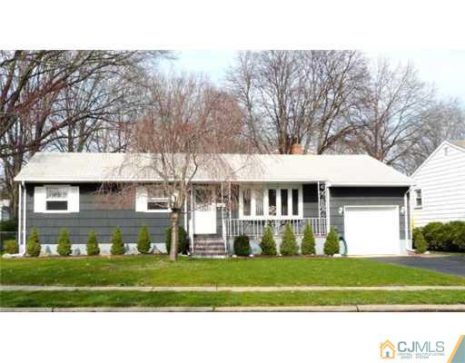 83 Stony Road Edison, NJ 08817 - Photo 1 of 11 a front view of a house with a yard