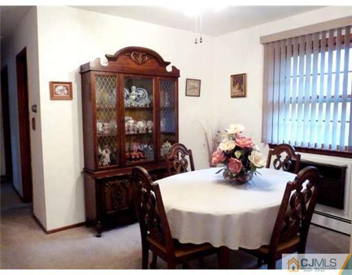 83 Stony Road Edison, NJ 08817 - Photo 3 of 11 a view of a dining room with furniture and window