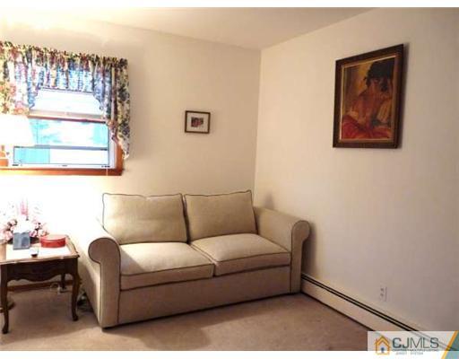 83 Stony Road Edison, NJ 08817 - Photo 7 of 11 a living room with furniture and a window