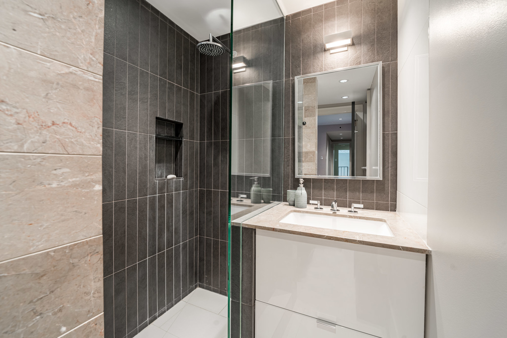 20 East Cedar Street, Unit 4D Chicago, IL 60611 - Photo 20 of 29 a bathroom with a sink and a mirror